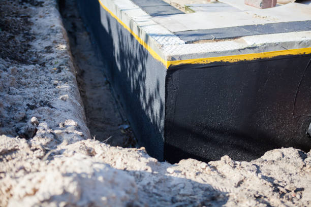 Professional Waterproofing technician working in Columbiana, AL